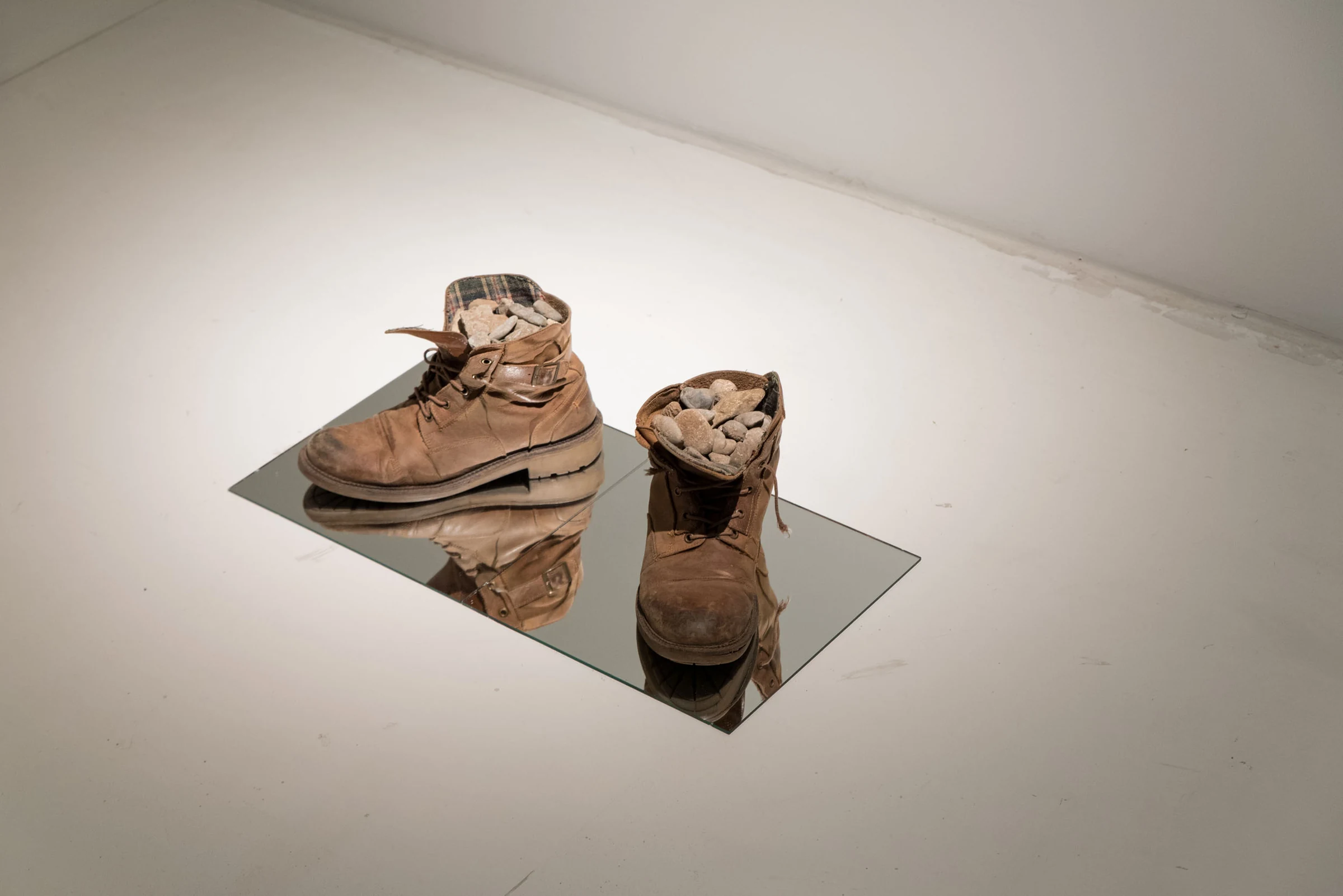 Atom (2018) — shoes, stones, mirror, wood, photograph by Siniša Radulović